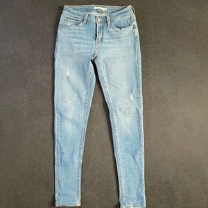 Levi’s 535 skinny jeans. Light wash will minor distressing.